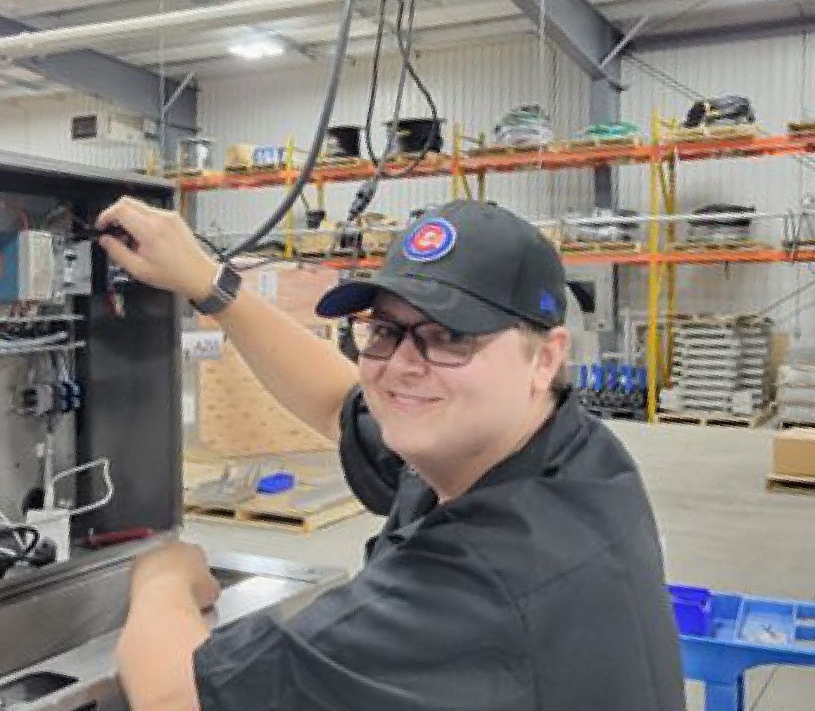 HMJ tech engineer working on dispenser